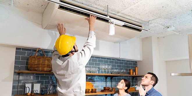 technician perform-AC-installation-while homeowner watching the process in Tulsa,-Ok